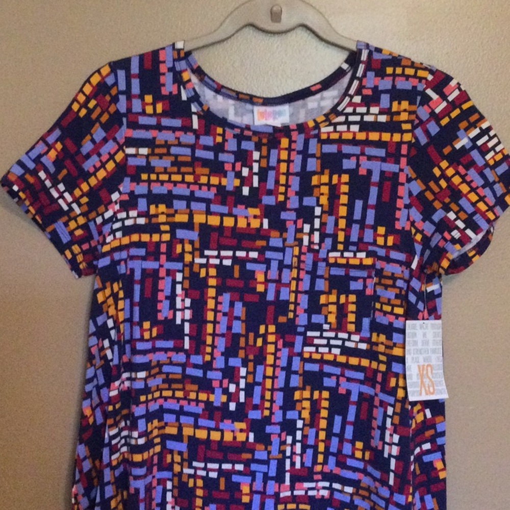 New with tags Lularoe Carly Dress, size XS. Navy with geometric pattern